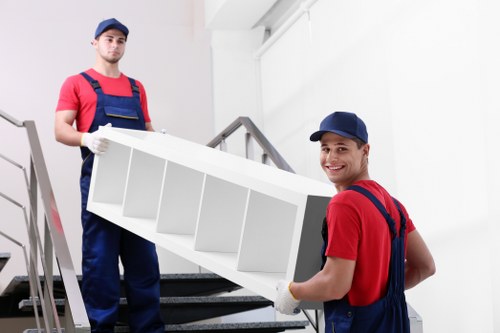 Local moving team preparing boxes and furniture for transport