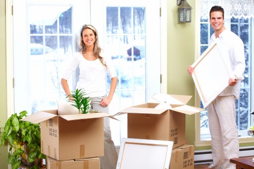 Local house removalists managing furniture transport on a residential Harringay street