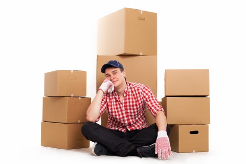 Moving furniture through a narrow stairwell in a Harringay flat or terrace house
