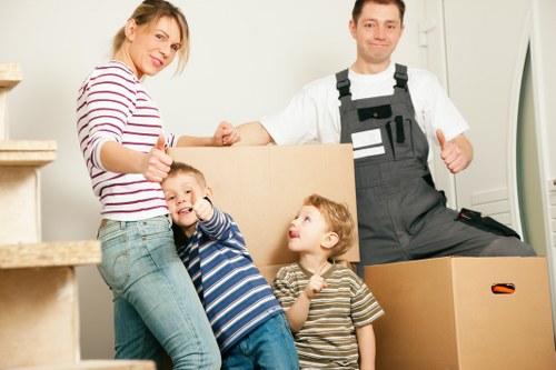 Careful loading of household items into a removal van